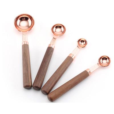 China Sustainable Food Grade Stainless Steel Copper Doser Set With Wooden Handle for sale