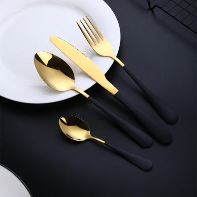 China Durable Custom Stainless Steel Gold Color Clear Handle Flatware Set and Black Cutlery for sale