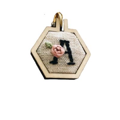 China Custom Cheap Polyester Hexagon Rose Alphabet Embroidered Keyring Decoration Key Chain for sale