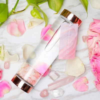 China Viable Rose Quartz Crystal Water Bottle Rose Gold Gem Stone Infused Glass Water Bottle for sale