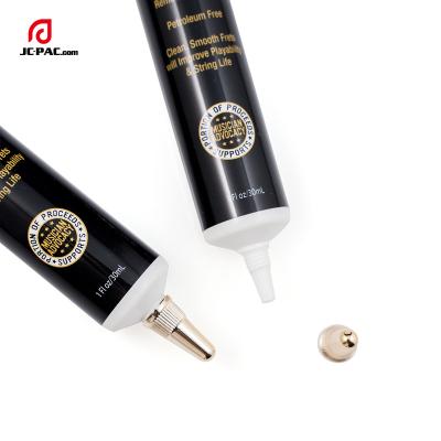 China Factory Price Cosmetic Black Cosmetic Plastic Tube With Gold Cap Metal Spout Tube For Eye Serum Tube for sale