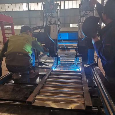 China Automatic trailer/construction MIG laser tracking/cat welding machine for corrugated pressure plate solid beam welding for sale