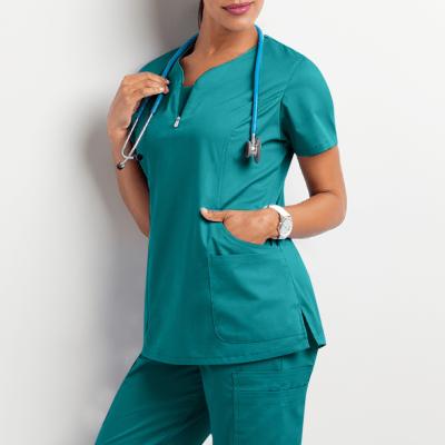 China Hot Selling Women's Hospital Uniform Classic Scrub Set For Women Crossover Top And Multi Pocket Pants for sale