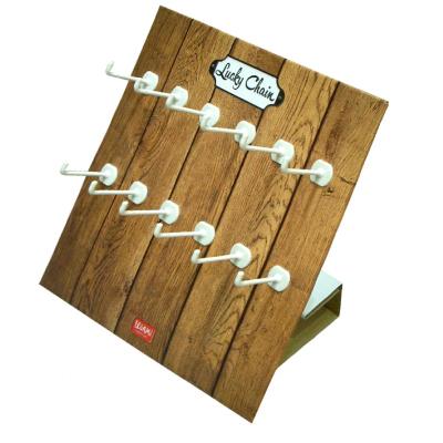 China Custom Shape Unique Corrugated Cardboard Paper Twelve White Peg Hooks Tray Countertop Display For Supermarket H1401011 for sale