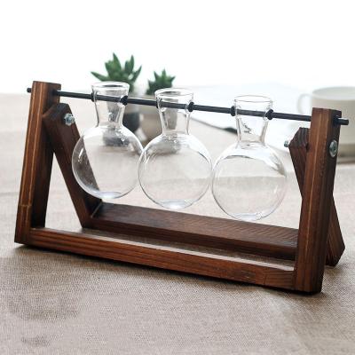 China Europe Large Creative Hydroponic Plant Vase Wooden Frame Clear Glass Vase for sale