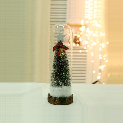 China Hand Blown Glass Decoration 11*30cm Christmas Tree In Glass Dome With LED String Light Battery Operated Christmas Festival for sale