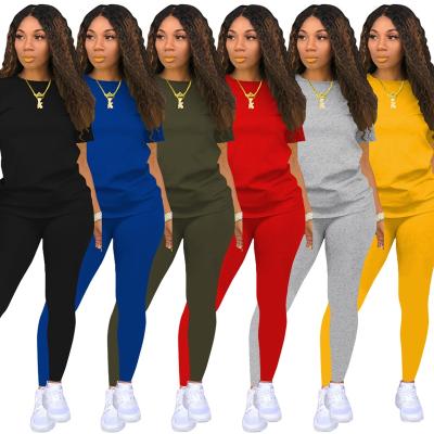 China fast anti-wrinkle anti-wrinkle shipping 2021 summer fashion pure color sports short girdle fitness pant suit leisure pants two-piece set for sale