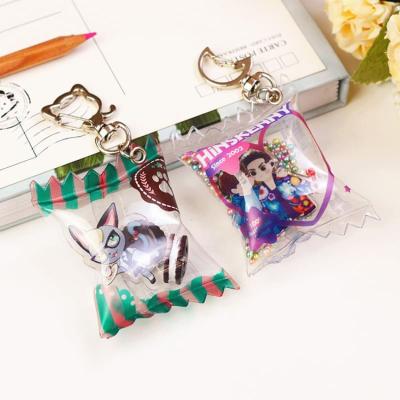 China 2021 OEM Transparent Acrylic Candy Bag Decoration Inflatable Candy Keychain Anime Candy Keychains As Promotional for sale