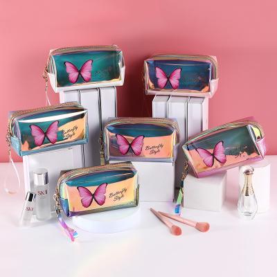 China Vintage Small PU Waterproof Wash Bag Custom Colored Holographic PVC Cosmetic Bag PVC Jelly Pouch Makeup Laser Storage Bag for sale