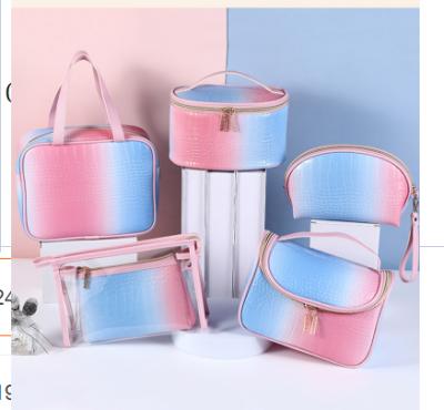 China Vintage Trending 2021 High Capacity PU Water Proof Gradient Travel Cosmetic Bags&cases Makeup Storage Bags Korean Pink Blue for sale