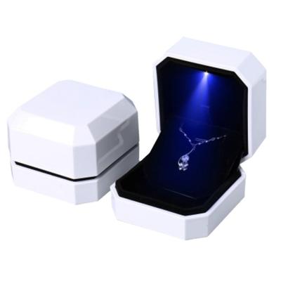 China Storage Wholesale Lacquer Finish LED Light Plastic Ring Pendant Jewelry Packaging Display Box Casket for sale