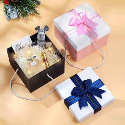 China Recyclable Custom Square Empty Paper Bowknot Logo Bridesmaid Cosmetic Gift Box Valentine's Day Surprise Box for sale