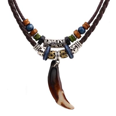 China Vintage Handmade Beads Braided Leather Rope Wolf Tooth Charm Pendant Necklace for sale