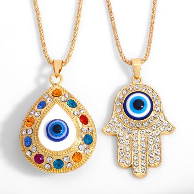 China Trendy Design Alloy Fatima Hand With Blue Eyes Rhinestone Pendant Necklace for sale