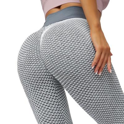 China Sweat-Wicking Jacquard Yoga Pants Skinny Fitness Sports Pants High Waist Mesh Honeycomb Design Leggings Women for sale