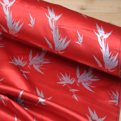 China Pure Silk Brocade Bamboo Leaf Red Color Chinese Jacquard Silk Fabric for sale