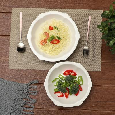 China Yantai Tongli Chinese Ceramic Stocked Bowl Food Snacks Large Serving Bowl White Special Shaped Embossed Salad Bowl for sale