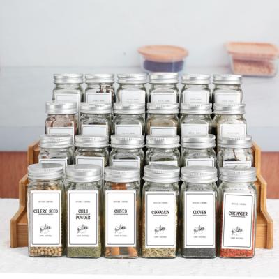 China Viable 24 Pcs Empty 4 Oz Square Spice Bottles Glass Spice Jars Set With Silicone 1pcs Heads 28pcs Square Labels 24 Silver Lids for sale