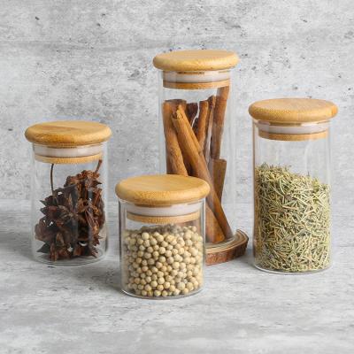 China Factory Stocked Directly Supply Clear Round Glass Storage 100ml Wooden Spice Jar Wirh Lids for sale