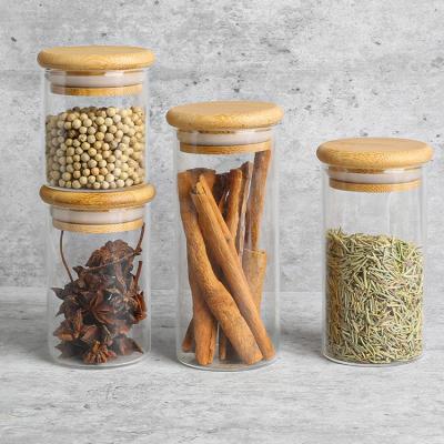 China Multi Sizes Stocked Less Quality Borosilicate Glass Spice Jars Bottles With Wooden Lids for sale