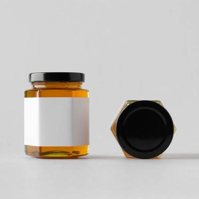 China Custom Freshness Preservation All Label 180Ml 280Ml 380Ml 500Ml Size Single Hexagon Shaped Glass Jars For Honey Jam With Metal Lids for sale