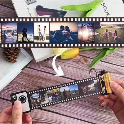 China Eco-friendly Material Personalized Keychains With Custom 10 Photo Camera Film Roll Key Chain for sale