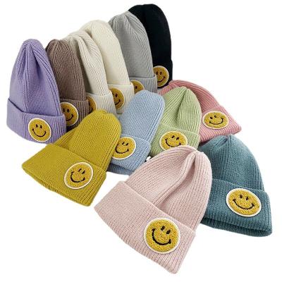 China Free Shipping Square For USA Autumn And Winter Smiley Face Labeling Couple Knitted Hat Fashion Thick Slipover for sale