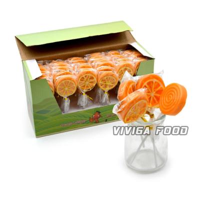 China ODM Natural Delicious Swirl Cartoon Orange Fruit Shape Crystal Lollipop Candy for sale