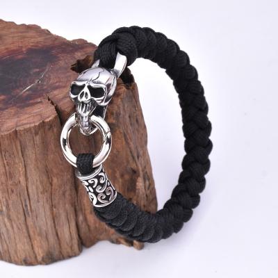 China Mens Punk Punk Jewelry Paracord Stainless Steel Mens Skull Handmade Bracelet for sale