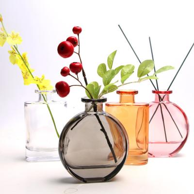 China Hot Selling Luxury Cosmetic 100ML Clear Flat Round Glass Thick Bottom Diffuser Bottle for sale