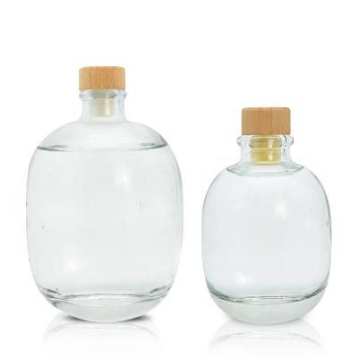 China 100ml 250ml 500ml High Quality Empty Clear Round Glass Whiskey Vodka Glass Wine Bottle With Cork Bamboo Cap for sale