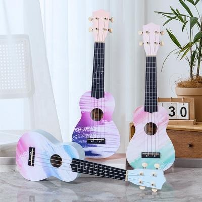 China Good quality 21 inch basswood ukulele can play musical instrument guitar small factory custom logo sticker soprano ukulele guitar for sale