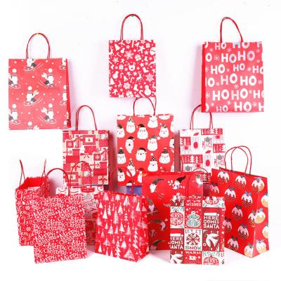 China Custom Recycled Materials Logo Red Designs Kraft Paper Christmas Sack Christmas Gift Bags for sale