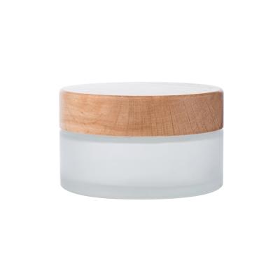 China 5g 15g 30g 50g 100g Cosmetic Skin Care Biodegradable Packaging Frosted Glass Jar With Bamboo Wood Cap Wholesale Bamboo Cosmetic Jar for sale