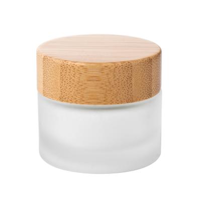 China 15g cream cosmetic glass jar with bamboo lid wholesales custom bamboo glass cosmetic jar for sale