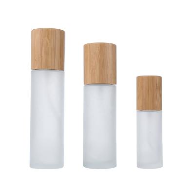 China 30ml 50ml 100ml 120ml cosmetic biodegradable bamboo cosmetic glass bottle with sustainable cap bamboo customization cosmetic packaging for sale