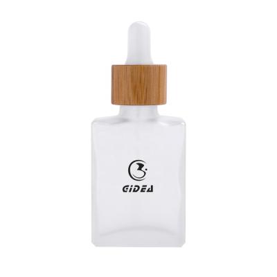 China Square 30ml Cosmetic Glass Cosmetic Bottle With Wholesale Bamboo Bottle Dropper And Bamboo Dropper Cap Biodegradable Cosmetic Bottle for sale