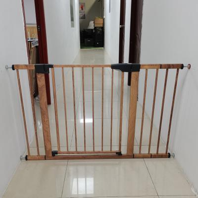 China Protect Baby Folding Wood Grain Fashion Barrier Gate Adjustable Baby Metal Toddler Safety Gate for Stairs for sale