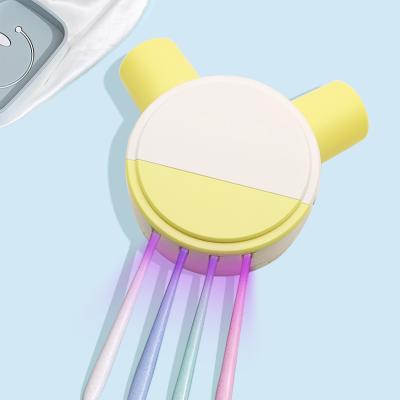 China Hotel& new yellow home toothbrush sterilizer with rechargeable cup FCC certified 99.9% sterilization rate toothbrush holder for sale