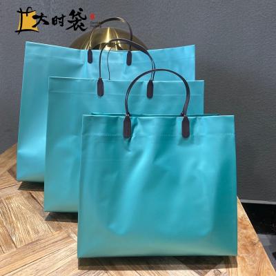 China Water Resistant Fashion PVC Tote Bag Rainbow Blue Transparent Jelly Laser Handle Holographic Bags With Rope Handle for sale