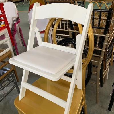 China Traditional American White Resin Padded Folding Chair For Wedding Outdoor Event Party Rentals for sale