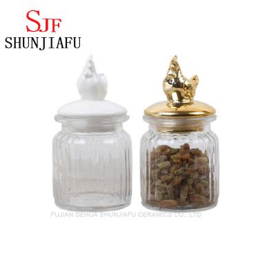 China Sustainable Round Glass Dried Fruit Candy Jar With Animal Lid Ceramic Glass Jar for sale