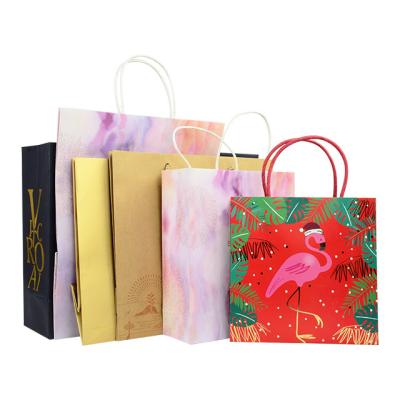 China Recycled Materials Christmas Gift Paper Bag Custom Uniquecolour Printing Commercial Luxury Shopping Gift Paper Bag With Logo for sale