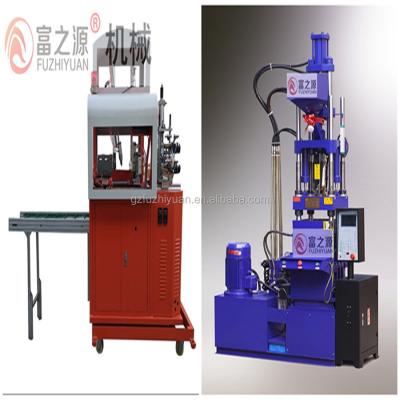 China VERTICAL plastic string label machine robotic arm manipulator and servo vertical plastic seal label thread injection molding machine for sale