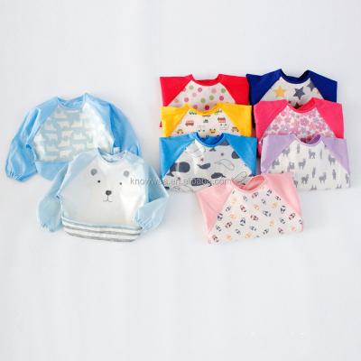 China Cute Reusable Sustainable Cotton EVA Baby Bib Smock Waterproof Baby Apron Sleeved Bib With Long Sleeve for sale