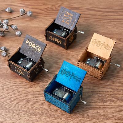 China Custom OEM New Arrival Mini Hand Crank Laser Engraved Wood Crank Music Box for sale