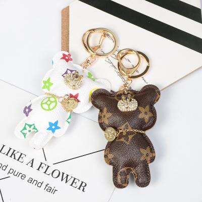 China New Design Portachiavi Cute Luxury Tassel Bear Leather Pom Pom Keychain Key Chain For Woman for sale