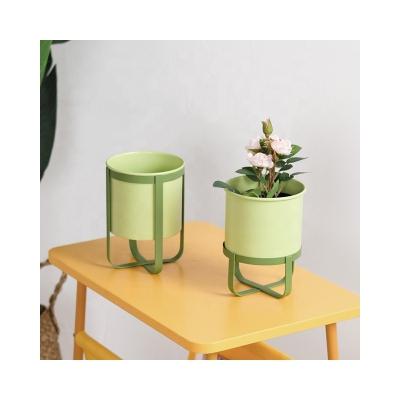 China Minimalism Green Metal Flower Pot For Home Spring Decoration Rack Planter Stand for sale