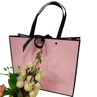 China Recyclable Large Size Luxury Clothes Packaging Paper Bag Recycled Gift Pink Shopping Paper Bag for sale