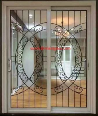 China Wrought iron glass panel with  12*12 black steel bar in sliding door for sale